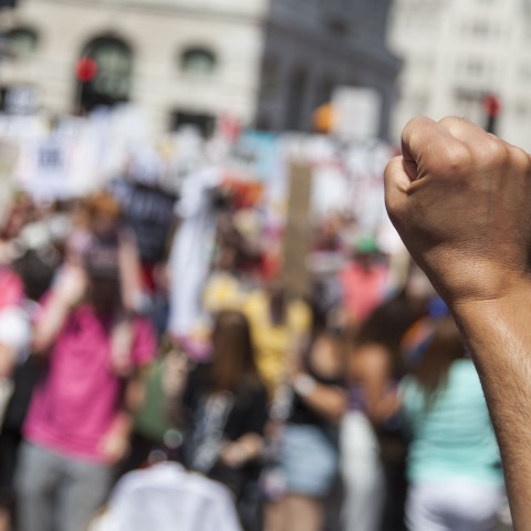 Close up of fist raised in the air