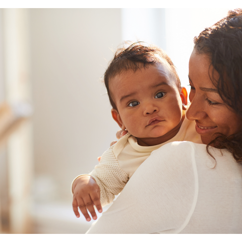 mother holding baby